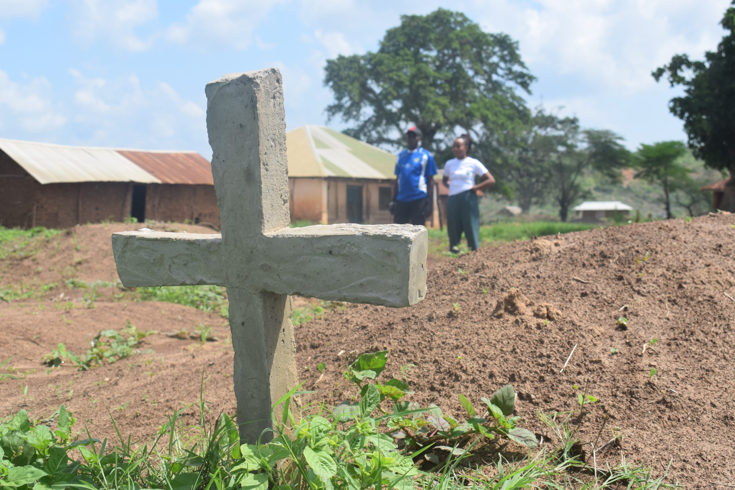 Haki Yetu Org Officer Warda Nzighe and the organisation’s Peace Ambassador in Malindi Francis Katana at the grave of Kesi Kenga Salehe in Kavunyalalo Village, Malindi Sub-County in Kilifi. Mr Salehe was killed in December 2021 by a mob who accused him of bewitching his two brothers who had earlier died out of road accident and Covid-19 respectively. /Photo Courtesy of Haki Yetu Org.
